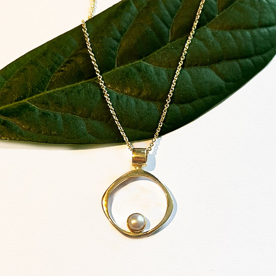 Fair trade brass pearl circle pendant