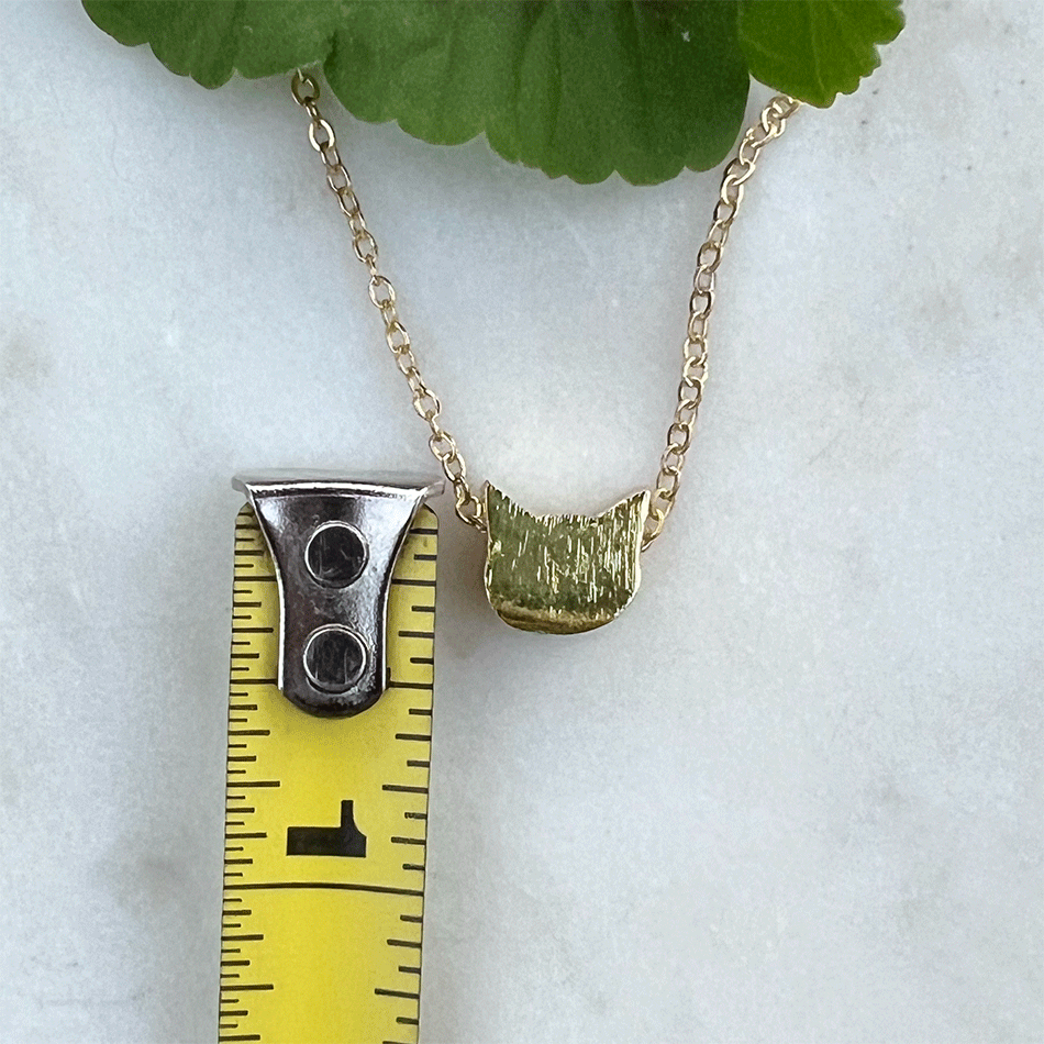 
fair trade gold cat face necklace