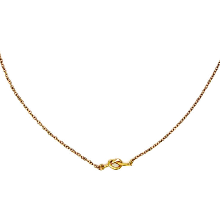 Fair trade brass knot necklace handmade by survivors of human trafficking.