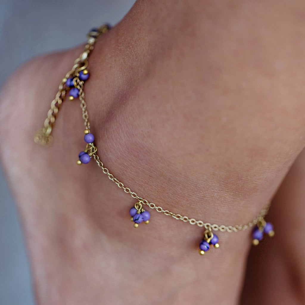 Fair trade anklet handmade by survivors of human trafficking.