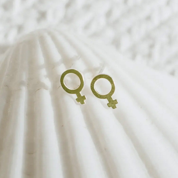 Women's symbol stud earrings handmade by survivors of human trafficking.