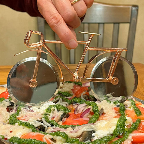 https://www.womenspeacecollection.com/cdn/shop/products/Pizza-cutter-close_large.jpg?v=1636593939