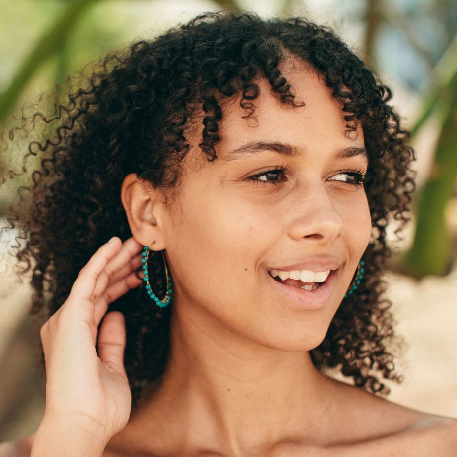 Fair trade turquoise hoop earrings handmade by survivors of human trafficking